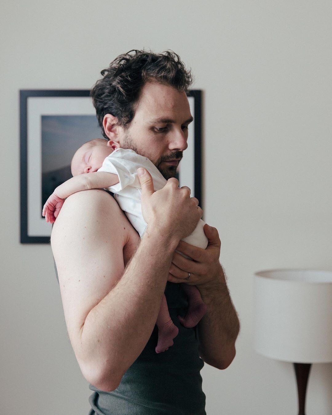 Ben holding new baby on Father's Day