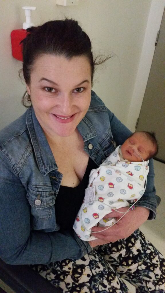 Renae single mother holding new baby Avery