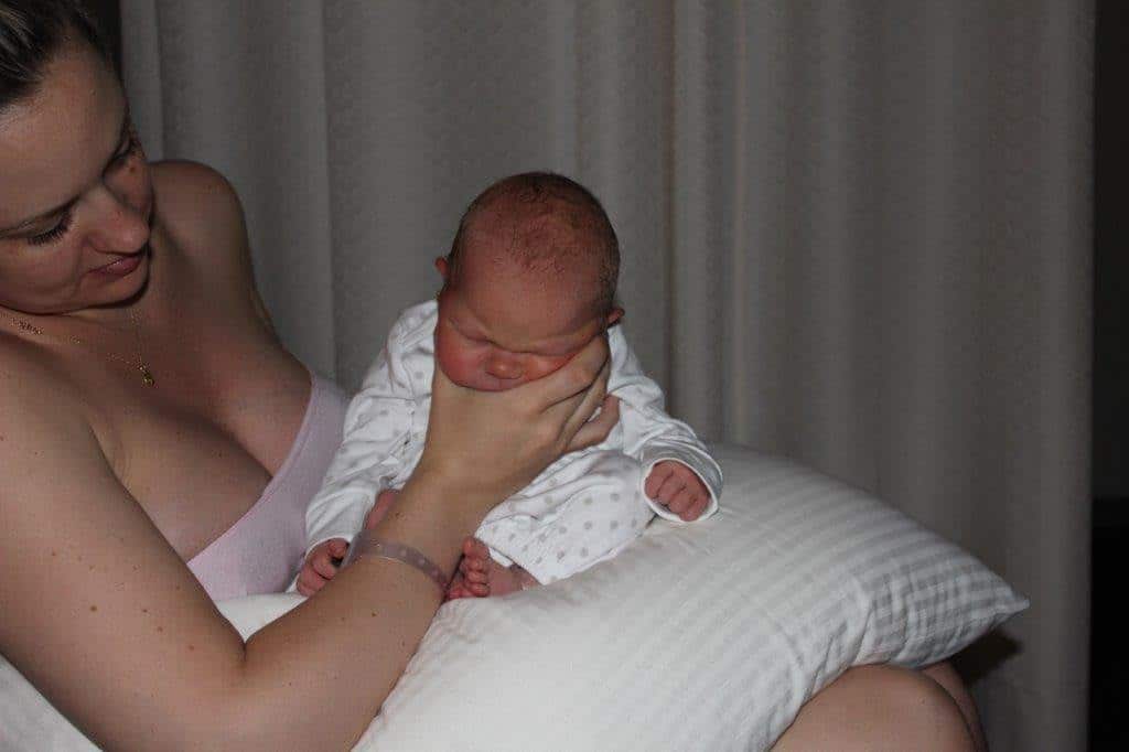 burping new born baby