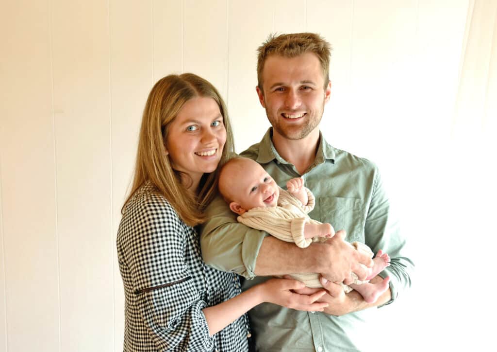steph and her husband and new baby