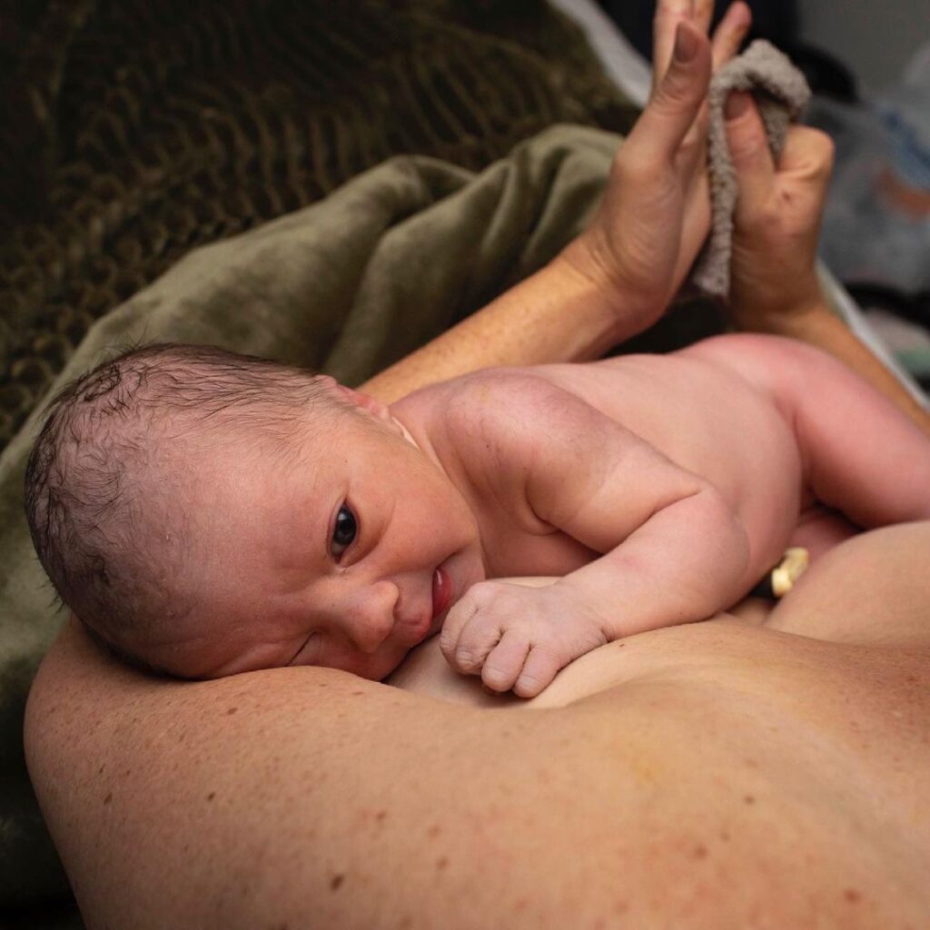 newborn baby breastfeeding after birth