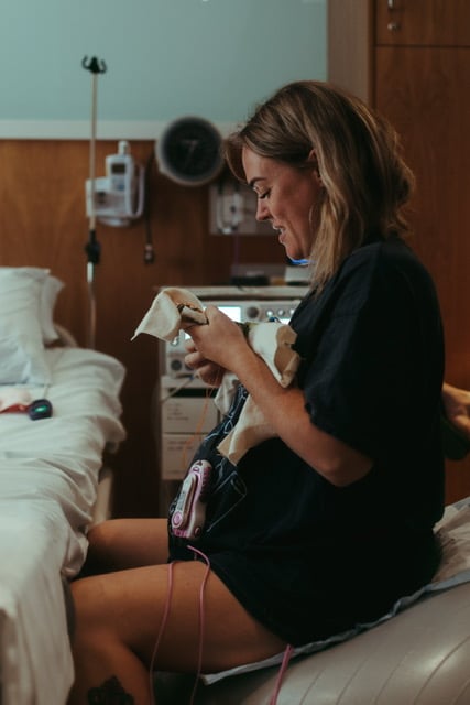 Larrisa labouring with TENS machine on swiss ball